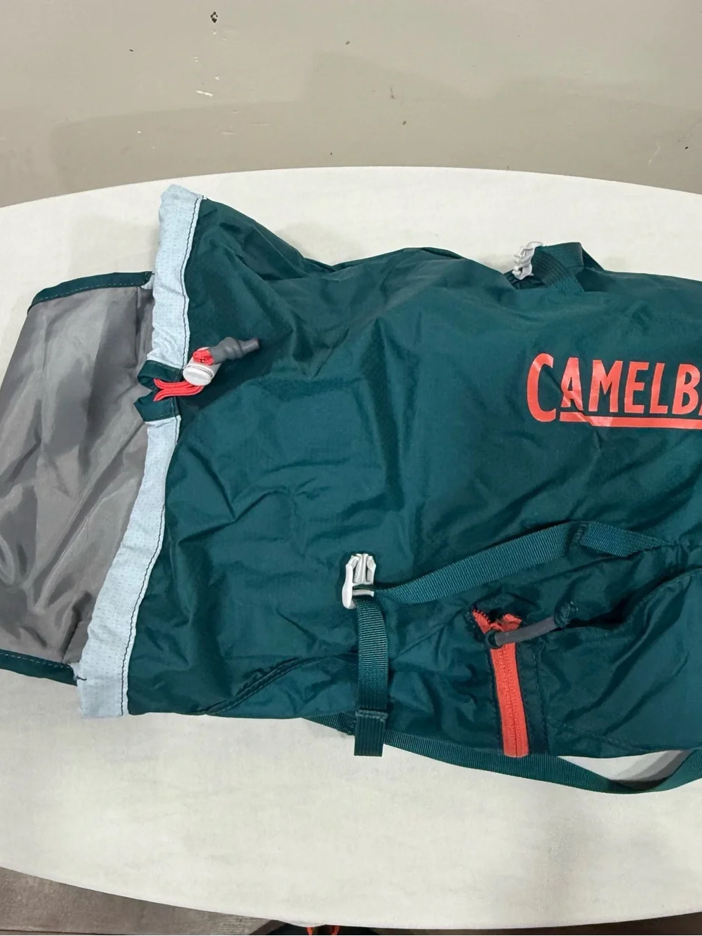 CamelBak backpack in teal with coral logo